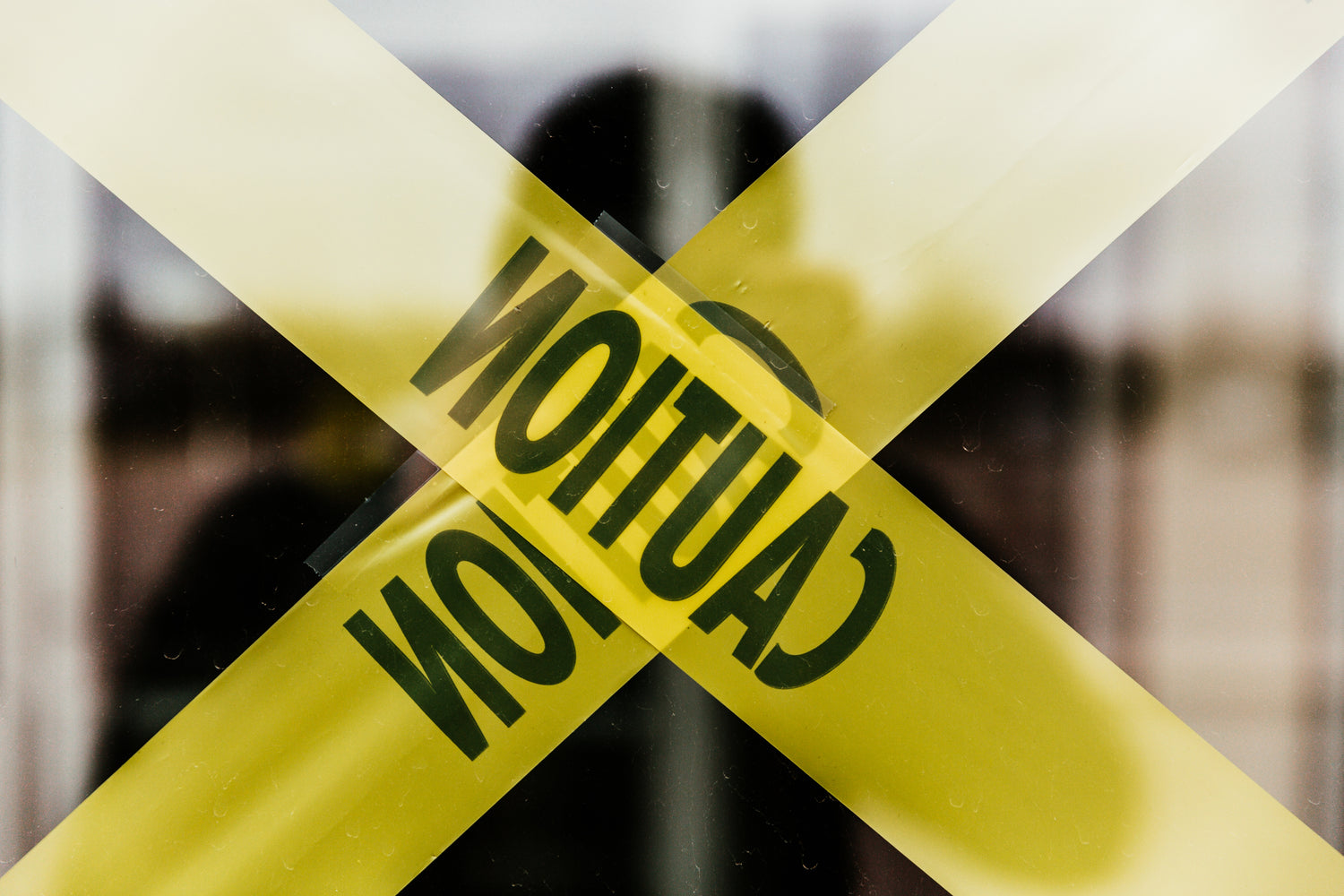 caution-tape-on-glass